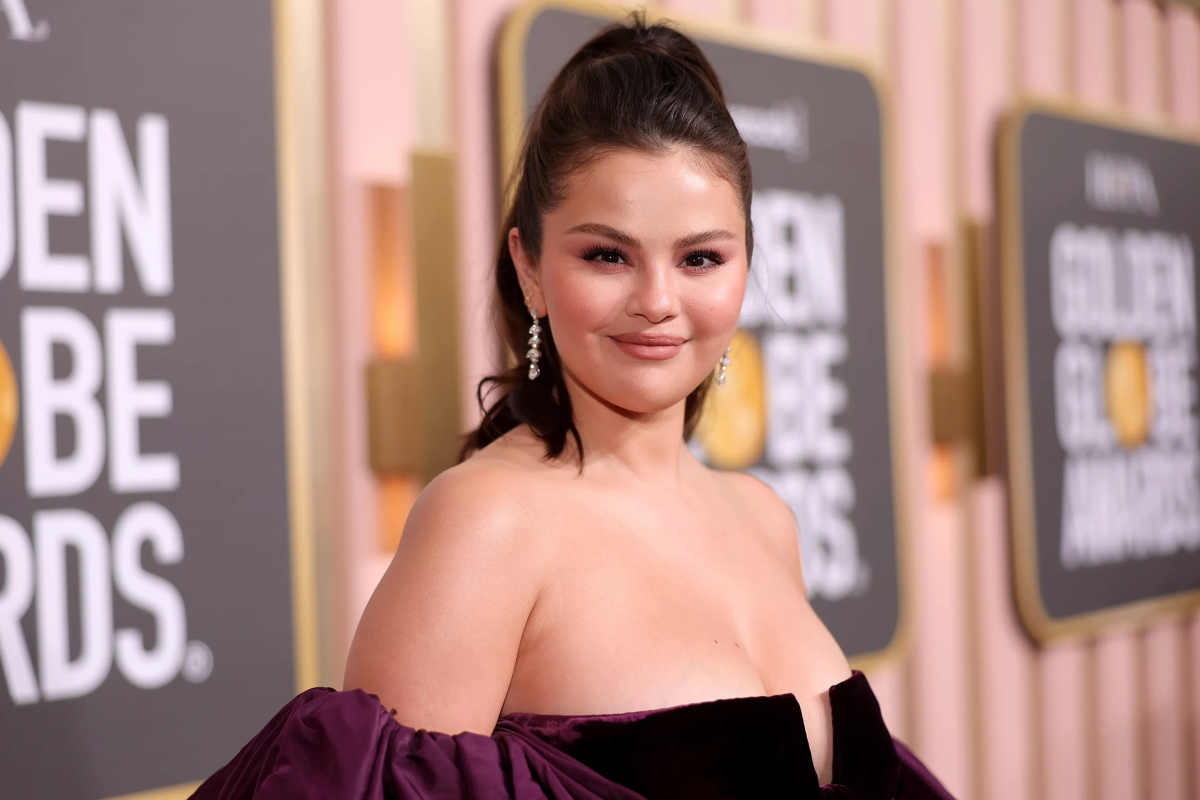 Selena Gomez shows off her hips by wearing a high cut swimsuit