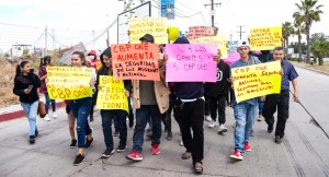 Hundreds of migrants protest in support of the Biden administration
