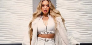 With a photo that shows her reclining and wearing a tight bodysuit, Chiquis Rivera recalls the cover of her mother