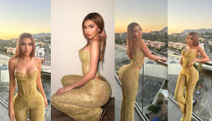 Posing from a balcony, Alexa Dellanos shows off her rear by wearing a tight outfit